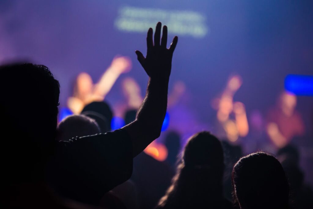 Hands worshipping at church